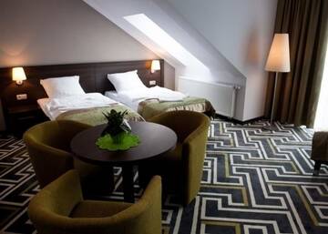 Фото номера Трехместный номер «Премиум» Отель Hotel &amp; Browar Słociak г. Ополе 2